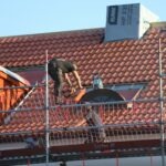 Roof repairs in progress on a tile roof in Byron Bay NSW
