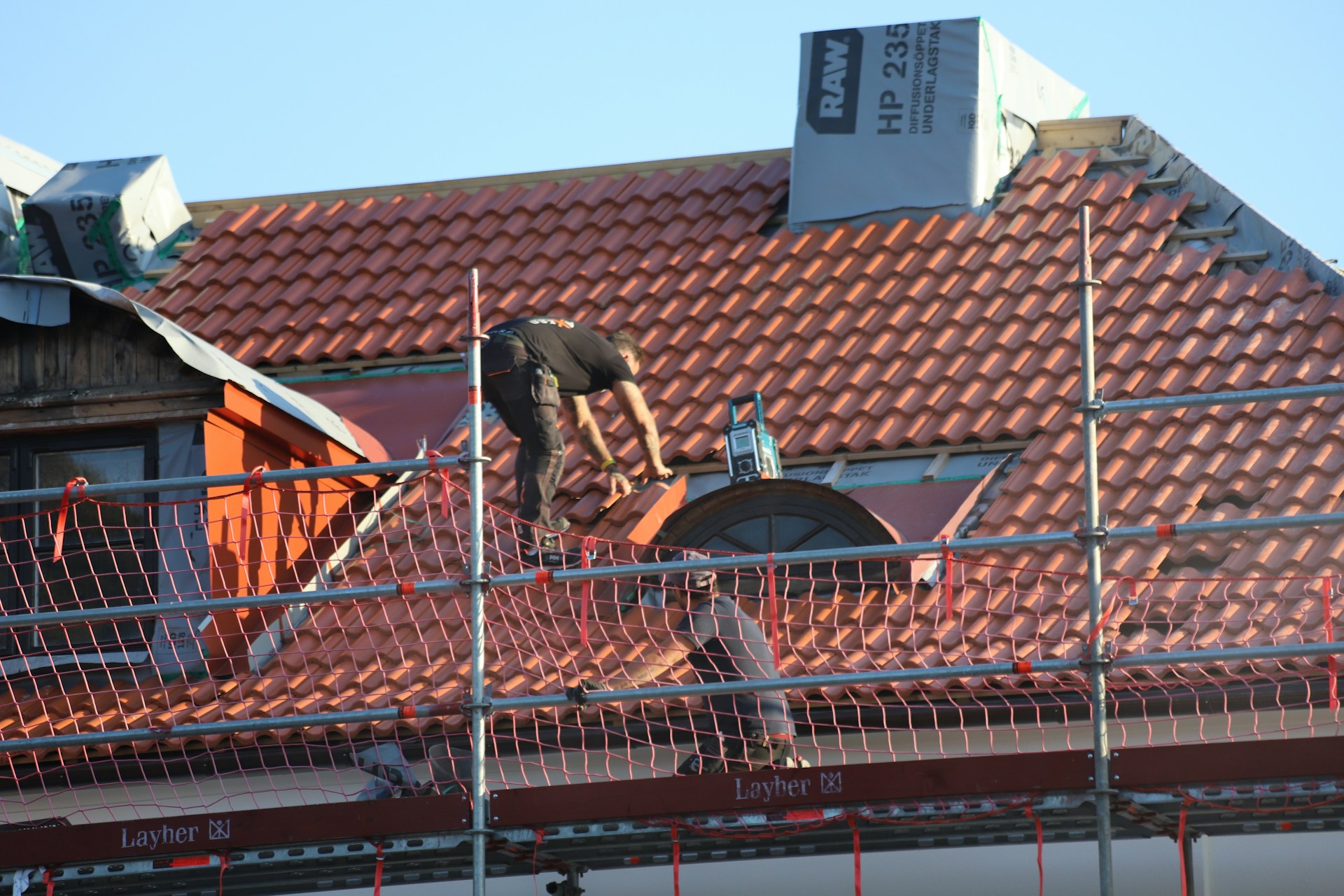 Roof repairs in progress on a tile roof in Byron Bay NSW